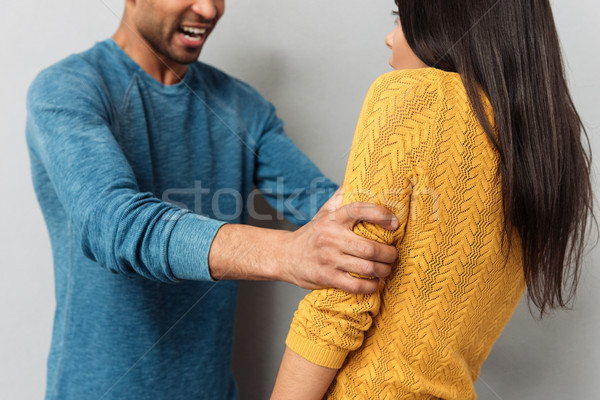 Immagine uomo spaventato donna isolato grigio Foto d'archivio © deandrobot