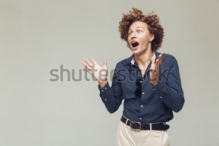 Happy retro man showing thumbs up. Stock photo © deandrobot