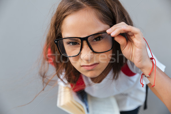Portrait sérieux brunette écolière lunettes [[stock_photo]] © deandrobot