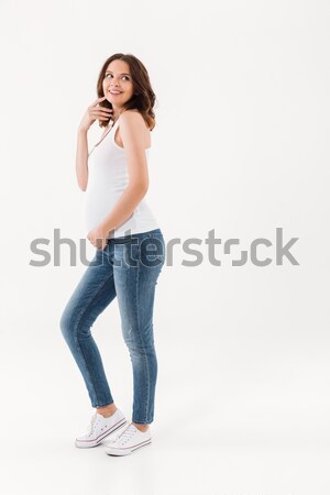 Szczęśliwy kobieta w ciąży stałego odizolowany zdjęcie zdumiewający Zdjęcia stock © deandrobot