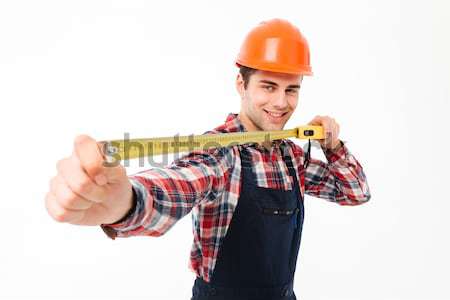 Portrait of a smiling young male builder Stock photo © deandrobot