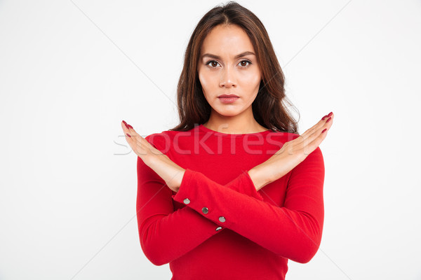 Portrait of a concentrated serious asian woman Stock photo © deandrobot