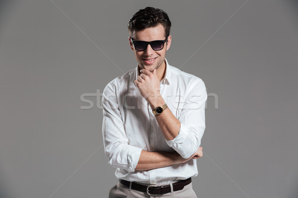 Portrait of a confident smiling man Stock photo © deandrobot