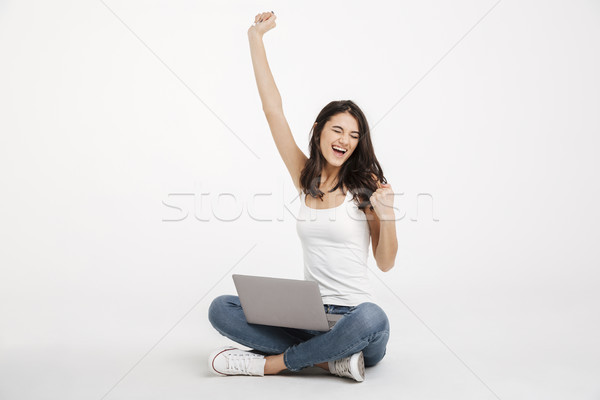 Portrait of a satisfied girl dressed in tank-top Stock photo © deandrobot