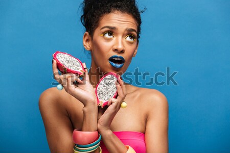 Colorful photo of thrilled mixed-race woman with trendy makeup a Stock photo © deandrobot
