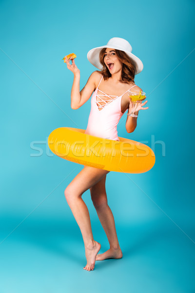Full length portrait of a pretty girl dressed in swimsuit Stock photo © deandrobot