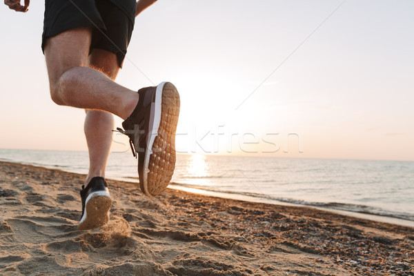 Blick zurück Beine läuft Sand Mann Fitness Stock foto © deandrobot