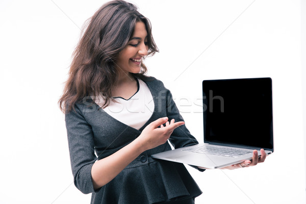 Businesswoman pointing on the laptop screen Stock photo © deandrobot