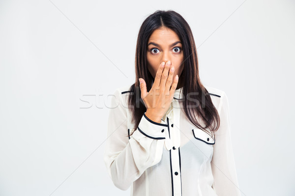 Shocked woman covering her mouth with palm Stock photo © deandrobot