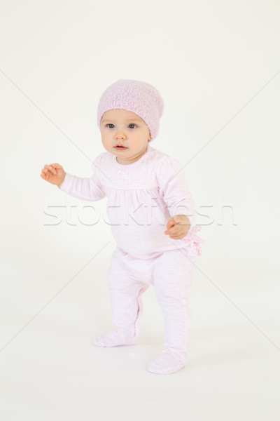 Cute little baby wearing hat standing on floor Stock photo © deandrobot