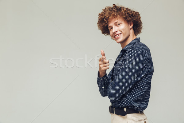 Happy retro man dressed in shirt standing and posing Stock photo © deandrobot