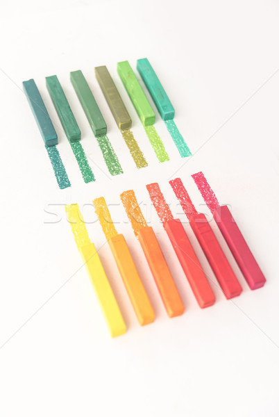 Close up photo of bright colorful pastel chalks and their pigmen Stock photo © deandrobot