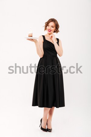 Full length portrait of a lovely girl holding plate Stock photo © deandrobot