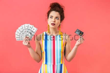 Emotional excited young pretty woman Stock photo © deandrobot