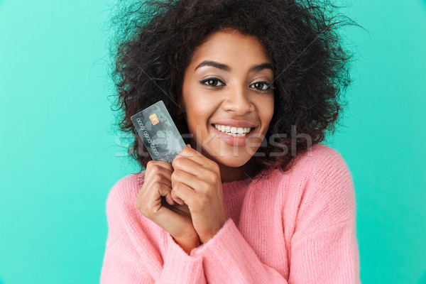 Portrait of adorable woman with shaggy hair holding plastic cred Stock photo © deandrobot
