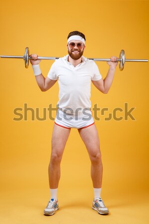 Young muscular man isolated on white  Stock photo © deandrobot