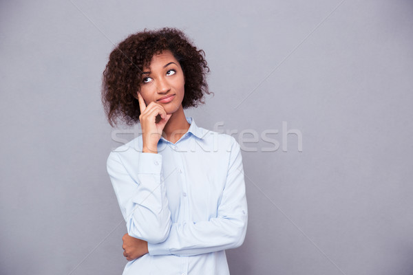 Afro american businesswoman looking up Stock photo © deandrobot
