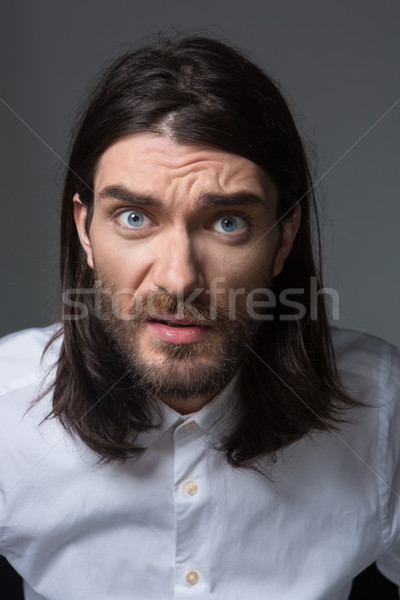 Angry man looking at camera Stock photo © deandrobot
