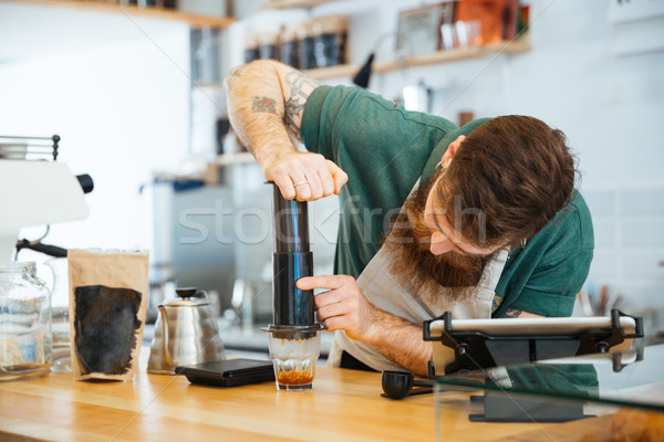 Barista preparing coffee  Stock photo © deandrobot