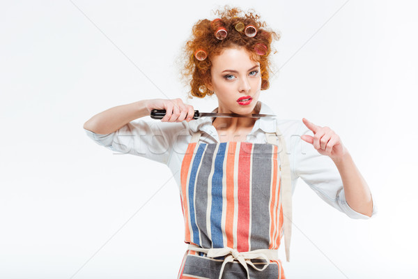 Beautiful housewife holding knife and pointing on you  Stock photo © deandrobot