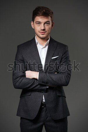 Knap zakenman zwart pak permanente portret Stockfoto © deandrobot