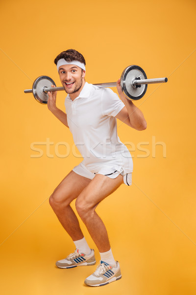 Alegre jovem barbell amarelo homem Foto stock © deandrobot