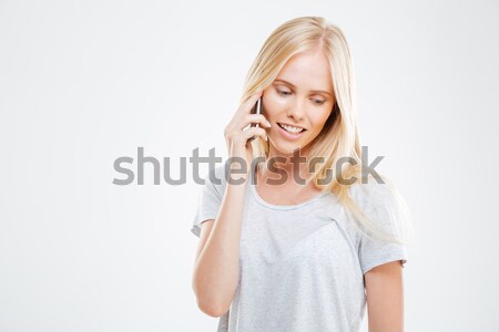 Cheerful young woman talking on the phone Stock photo © deandrobot