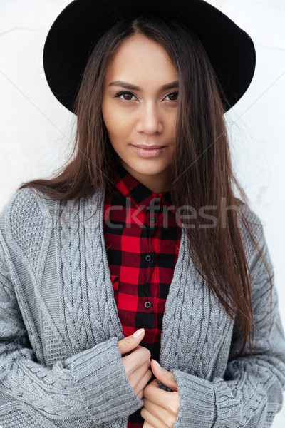 Portrait of beautiful woman starring at camera Stock photo © deandrobot