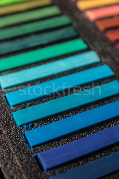 Cropped photo of new colorful chalk pastels in box Stock photo © deandrobot