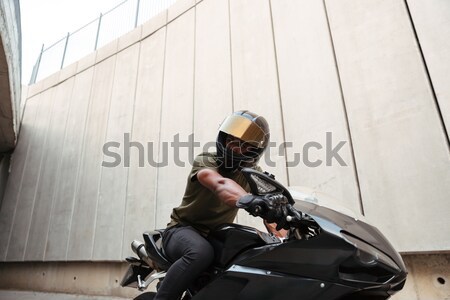 Portrait of a young afro american man in helmet Stock photo © deandrobot