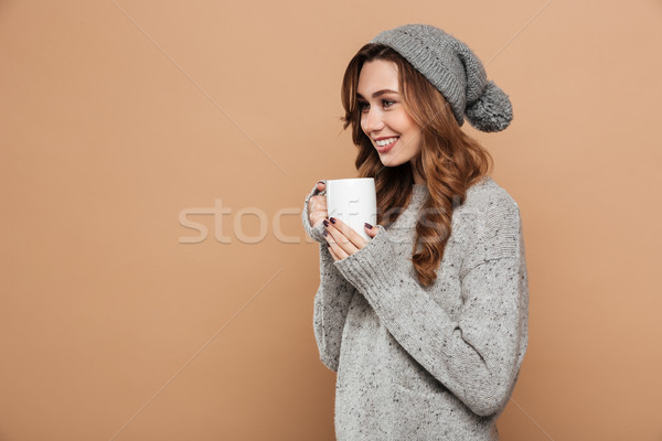 Fiatal vonzó nő gyapjú kalap pulóver kezek Stock fotó © deandrobot