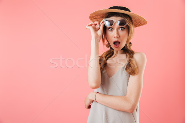 Shocked woman wearing in dress and hat take off sunglasses Stock photo © deandrobot