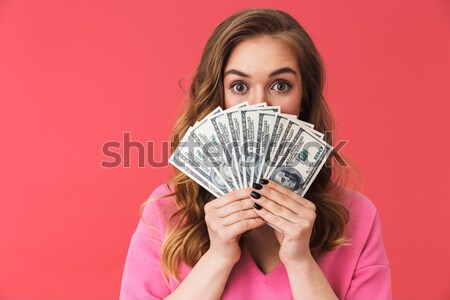 Portret verwonderd jong meisje geld bankbiljetten Stockfoto © deandrobot