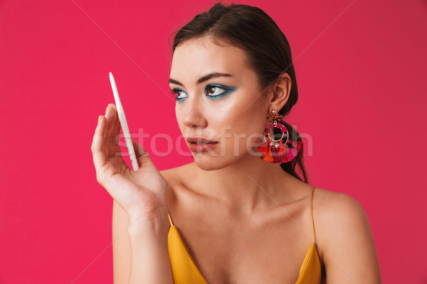 Foto moda pretty woman 20s indossare orecchini Foto d'archivio © deandrobot