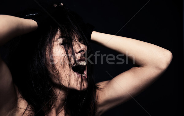 Portrait of a young woman shouting  Stock photo © deandrobot