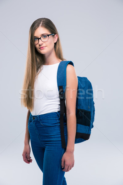 Portrait of a cute female teenager with backpack  Stock photo © deandrobot
