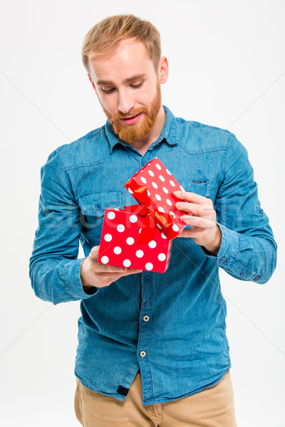 Foto stock: Animado · masculino · barba · jeans · camisas · abertura