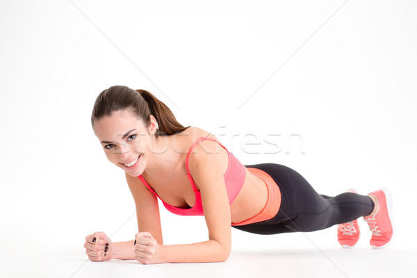 Wesoły piękna kobieta fitness deska wykonywania biały Zdjęcia stock © deandrobot
