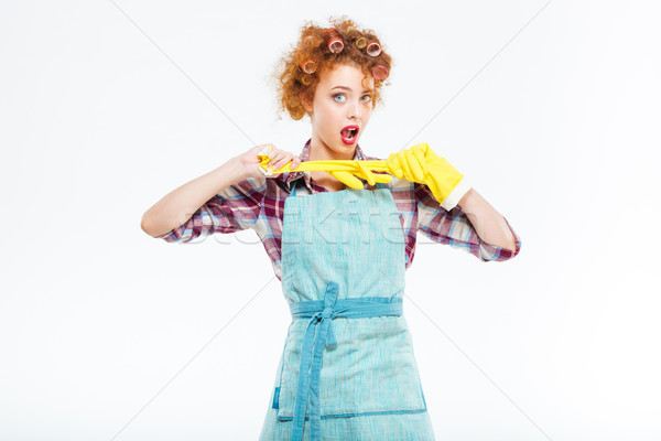 Attractive playful housewife posing with yellow protective gloves  Stock photo © deandrobot