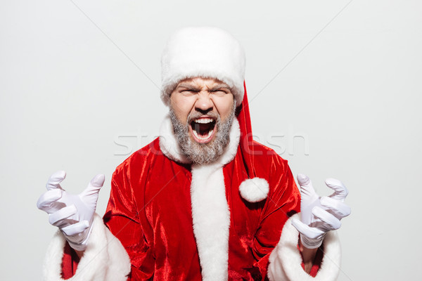 Pazza irritato uomo babbo natale piedi Foto d'archivio © deandrobot