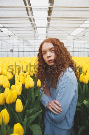 Kız gizleme çiçekler sarı çiçekler kadın Stok fotoğraf © deandrobot