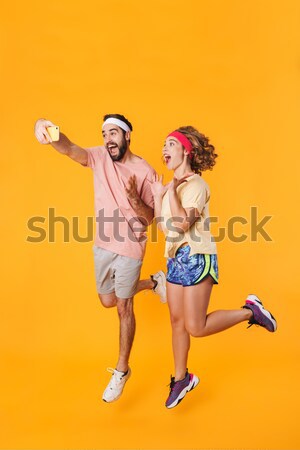 Displeased friends women in pajamas can't divide big teddy bear. Stock photo © deandrobot