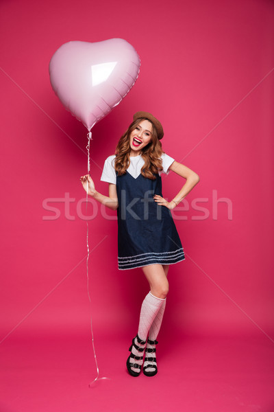 Happy beautiful lady in dress holding air balloon isolated Stock photo © deandrobot