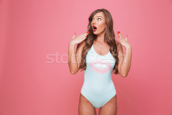 Portré megrémült fiatal nő fürdőruha másfelé néz izolált Stock fotó © deandrobot
