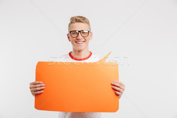 Photo of modern youngster wearing casual clothing and glasses ho Stock photo © deandrobot