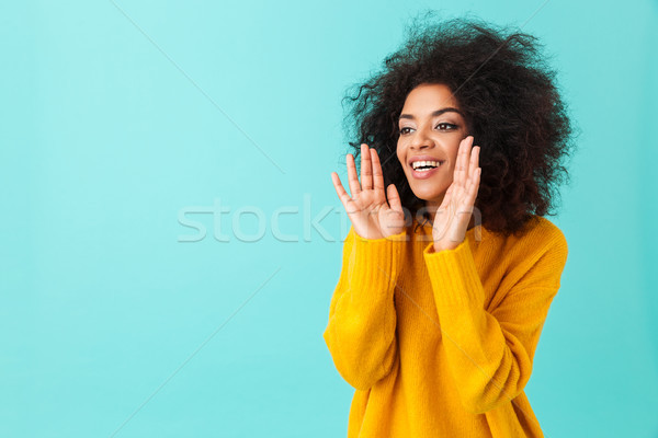 Stock photo: Multicolor portrait of splendid curly woman in yellow shirt hold