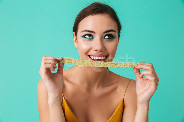 Close up of a pretty young girl with bright make-up Stock photo © deandrobot