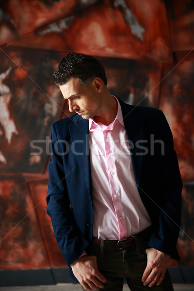 Fashion pensive man standing over industrial background Stock photo © deandrobot