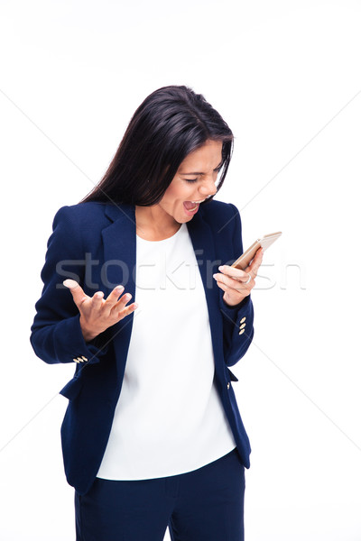 Businesswoman screaming on the phone Stock photo © deandrobot