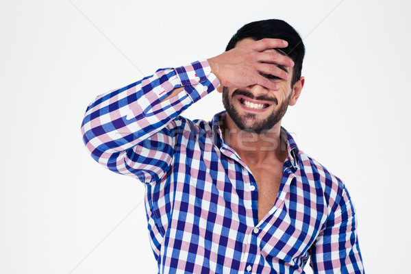 Portrait of upset man covering his eyes Stock photo © deandrobot